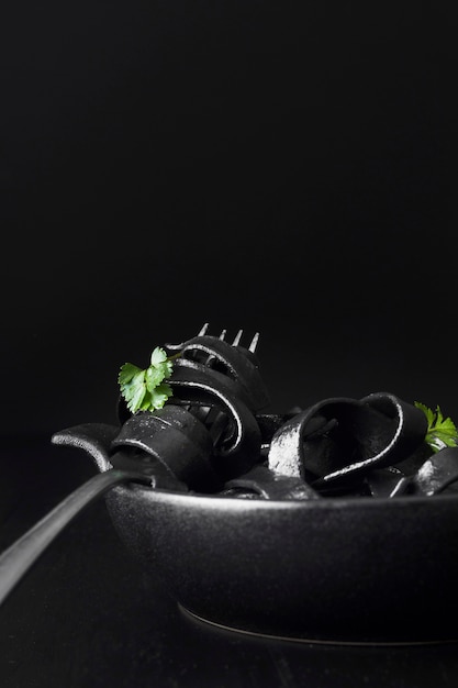 Free photo fresh black pasta on fork