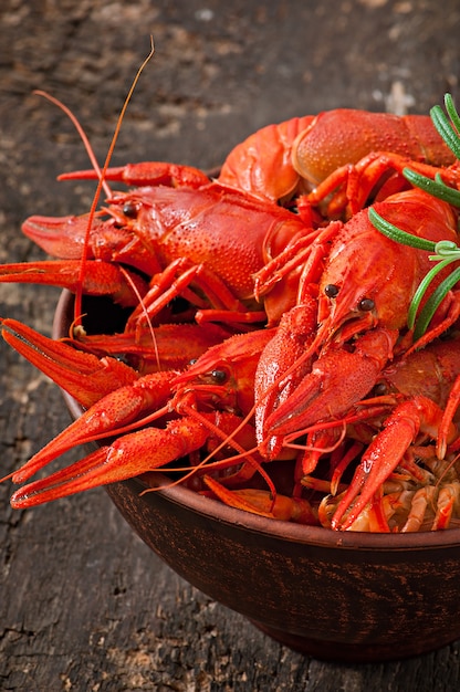 Fresh boiled crawfish on the old wooden surface