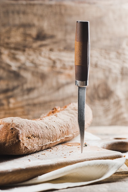 Fresh bread on table and knife