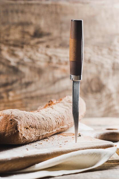 Fresh bread on table and knife