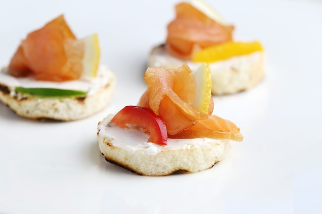 Fresh bruschetta appetizers isolated on a white surface