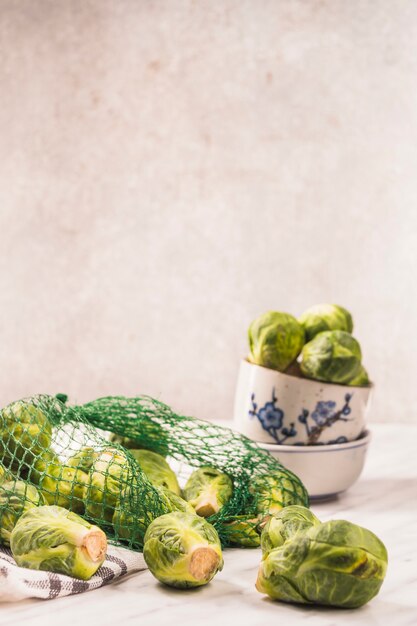 Fresh brussels sprouts on marble surface