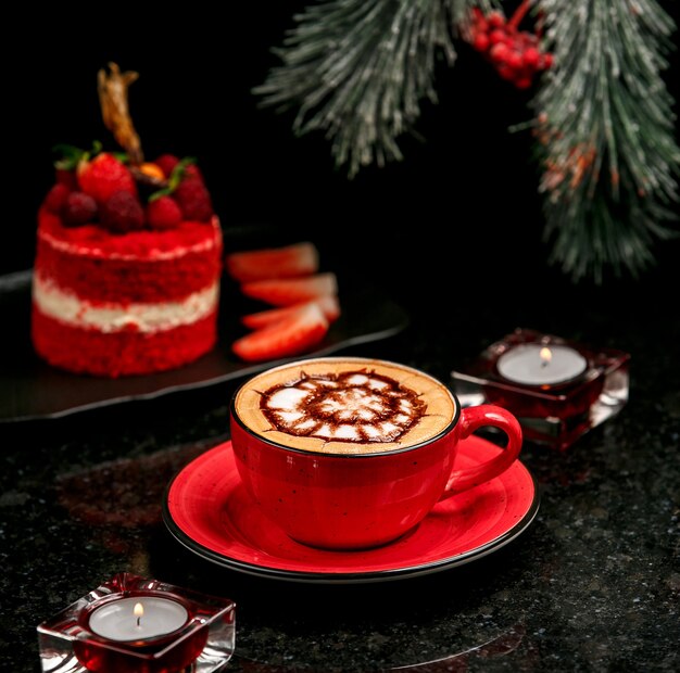 Fresh cappuccino in red cup