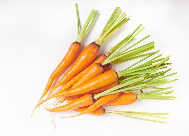 Fresh carrot isolated on white surface as package design element. Top view. Flat lay. freshly from home growth organic garden. Food concept.