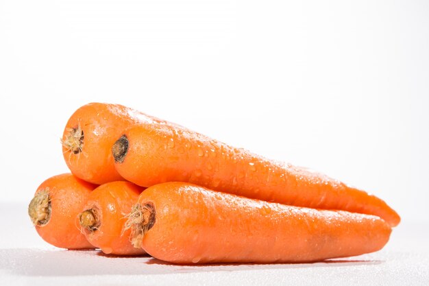 Fresh carrots on white background