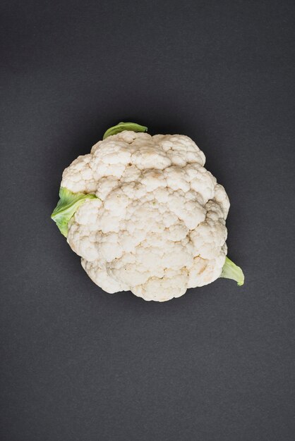 Fresh cauliflower on gray background