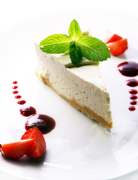 Fresh cheesecake served with mint 