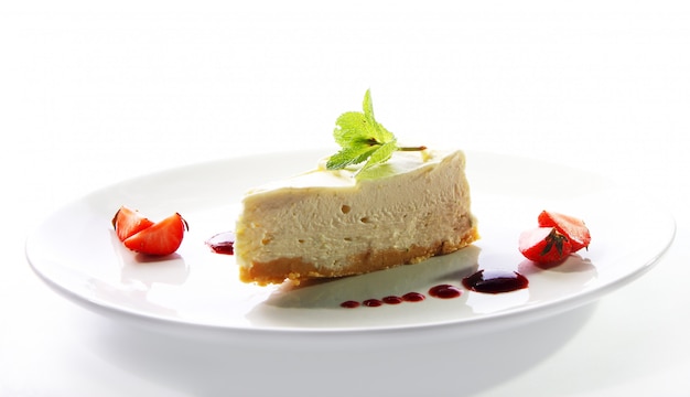 Fresh cheesecake served with mint 
