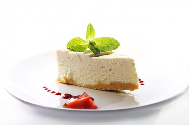 Fresh cheesecake served with mint 