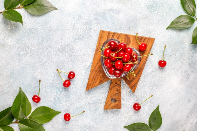 Fresh cherry on plate on  table