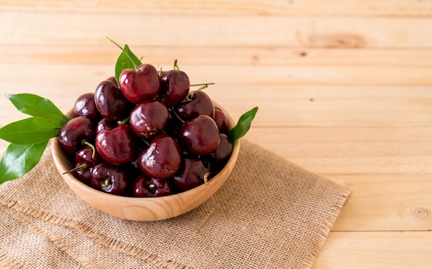 Fresh cherry in wood bowl