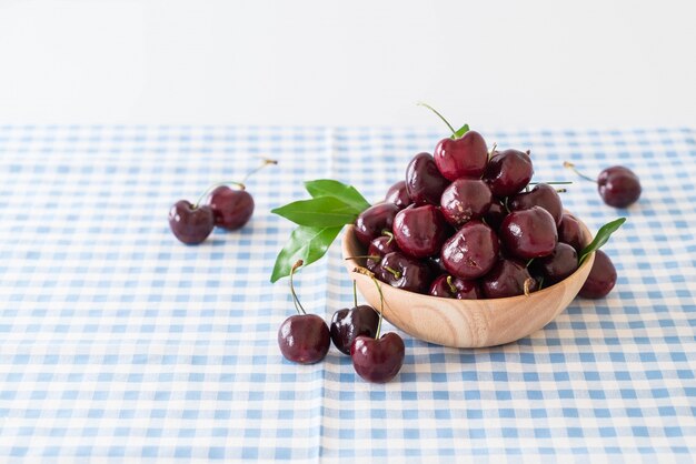 fresh cherry in wood bowl