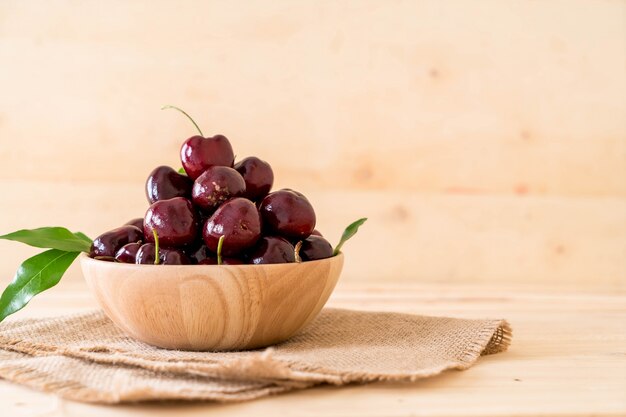 fresh cherry in wood bowl