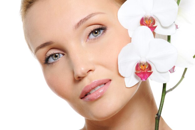 Fresh clear woman face with flowers