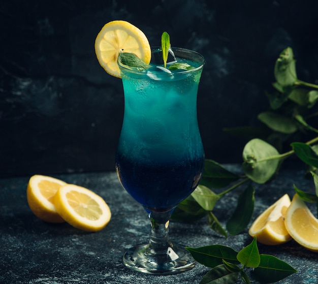 Fresh cocktail with curacao and lemon