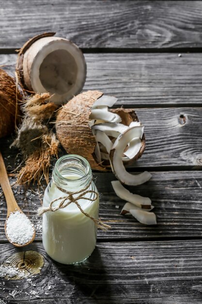 Fresh coconuts and coconut milk in bottle