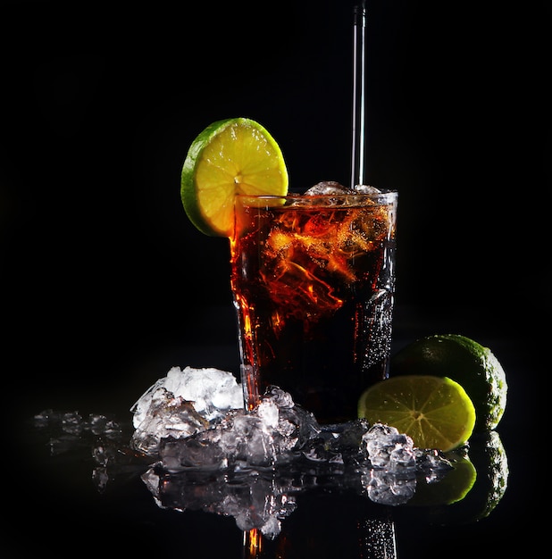 Fresh cola drink with green lime