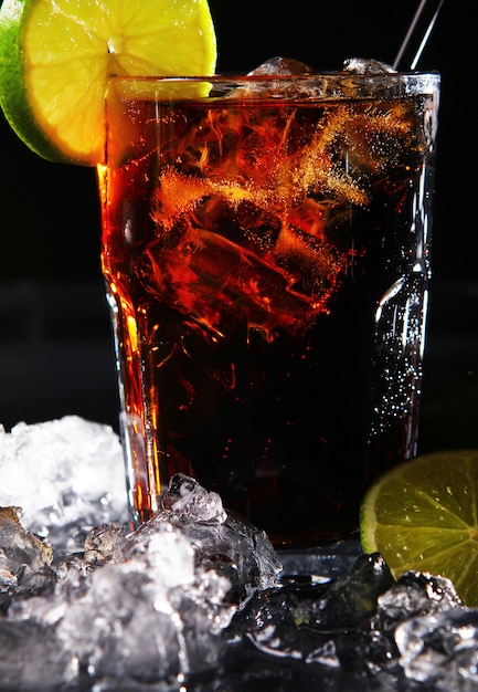 Fresh cola drink with green lime