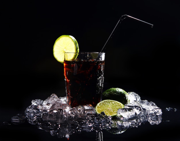 Fresh cola drink with green lime