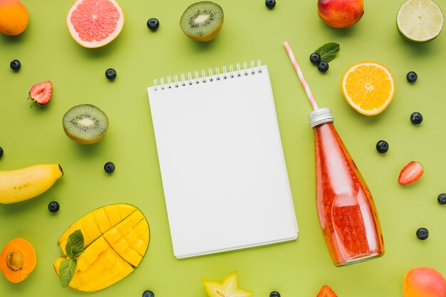 Fresh colorful flat lay with fruit and juices