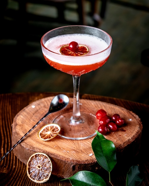 Fresh cranberry cocktail on wooden board