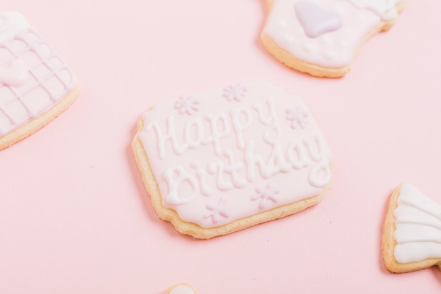 Fresh creamy cookie with happy birthday text over white background