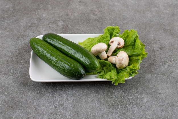 of fresh cucumber with lettuce and mushroom.