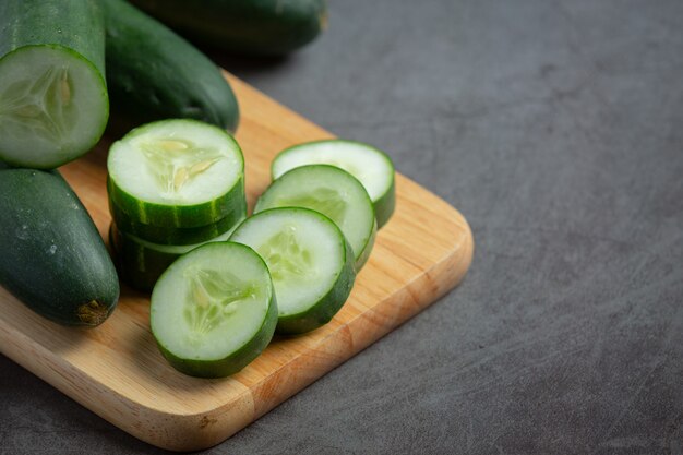 Free photo fresh cucumbers sliced on dark background