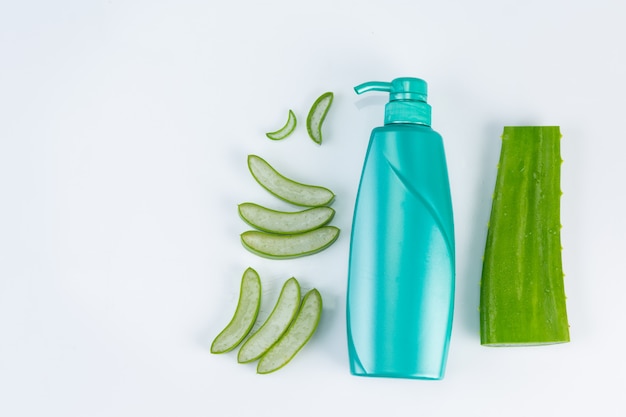 Fresh cut Aloe vera  leaves on white wall. Aloe vera essential  oil use from natural material use in beauty.