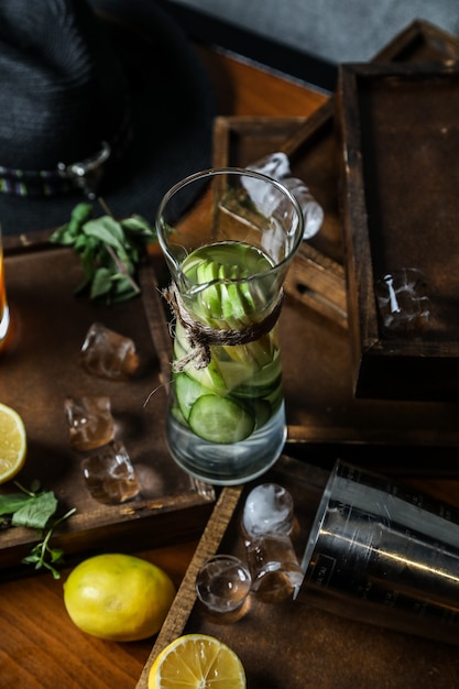 Fresh detox with vegetables and herbs on wooden desk