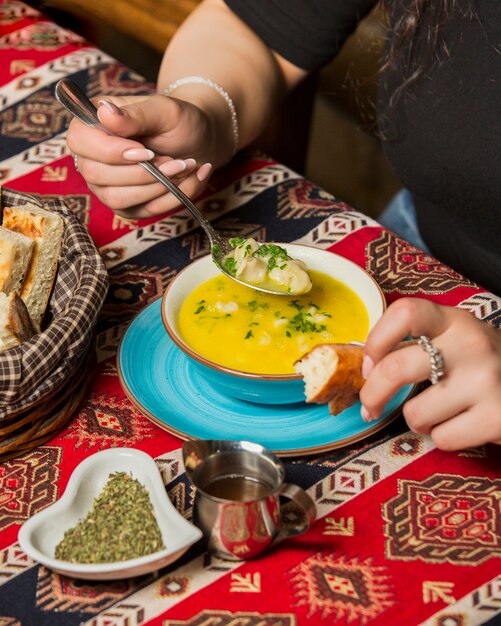 Fresh dushbere with bread on the table