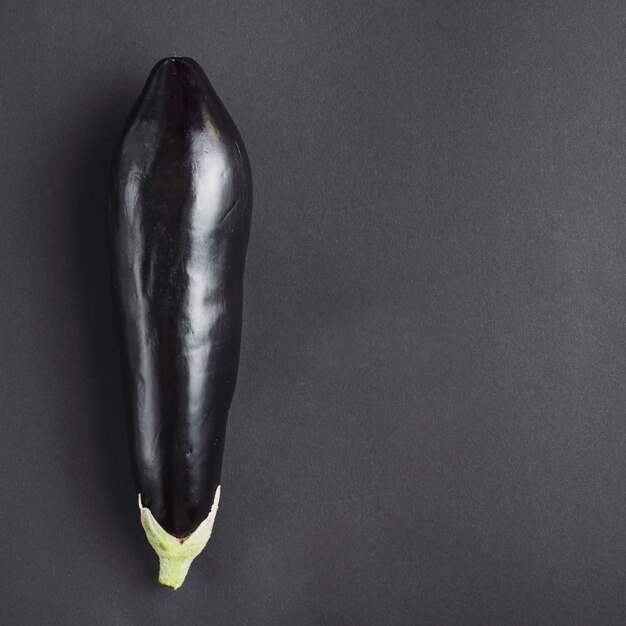 Fresh eggplant on gray background