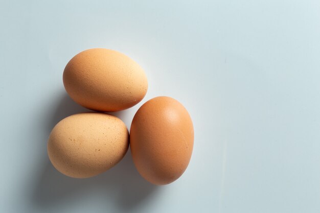 Fresh eggs in bowl.