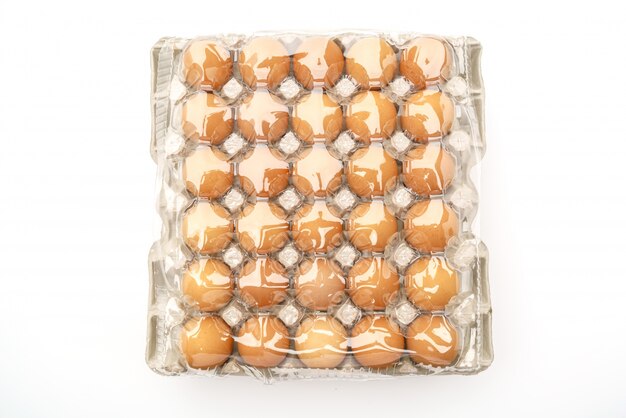Fresh eggs in package on White Background .