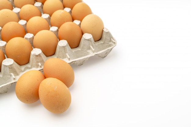 Fresh eggs in package on White Background .