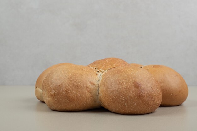 Fresh flower shaped bread on beige background. High quality photo