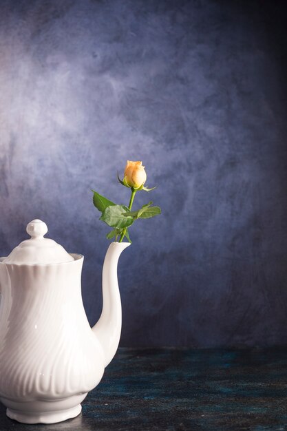 Fresh flower in vintage teapot