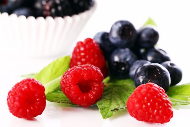 Free photo fresh forest berries over white