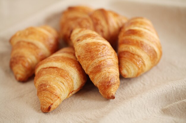 Fresh french croissants on a tablecloth