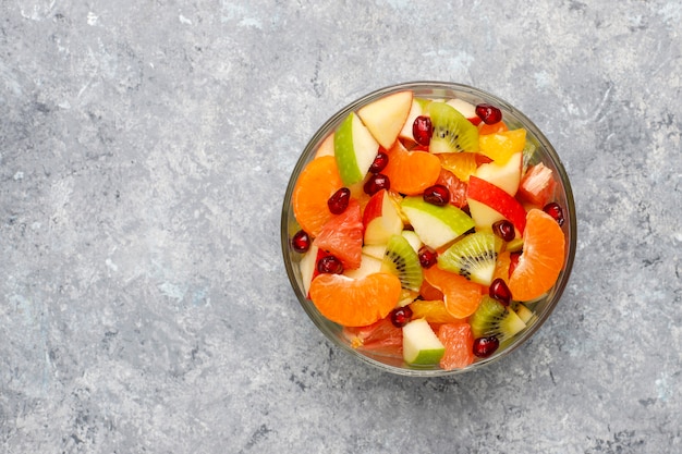 Fresh fruit salad in the bowl with fresh fruits.