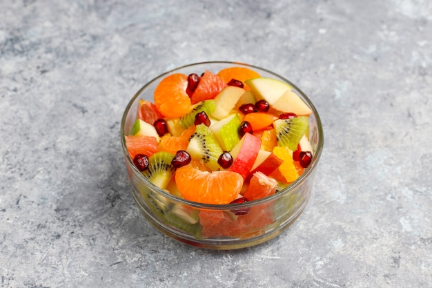 Fresh fruit salad in the bowl with fresh fruits.