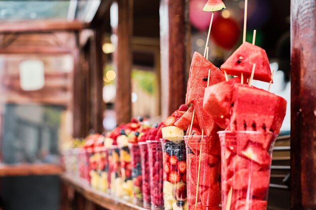 Fresh fruit vendor's shop selective focus Fresh fruits in glasses selective focus street vending in the old town Tbilisi