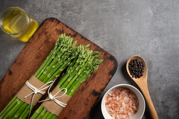 Fresh green asparagus on table.