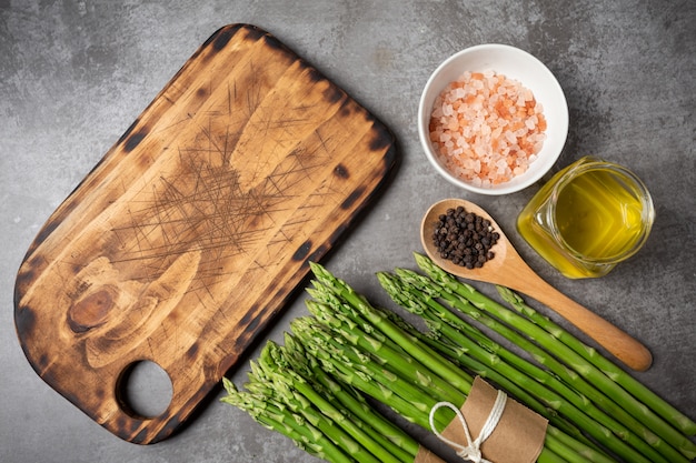 Free photo fresh green asparagus on table.