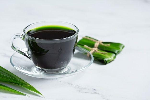 Fresh green pandan leaf on table