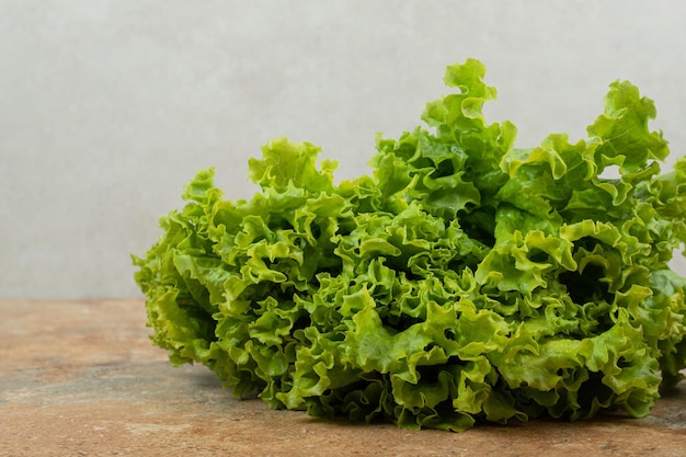 Fresh green vegetable on marble surface.