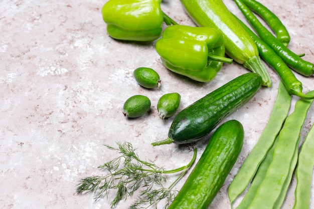 Fresh green vegetables on concrete surface