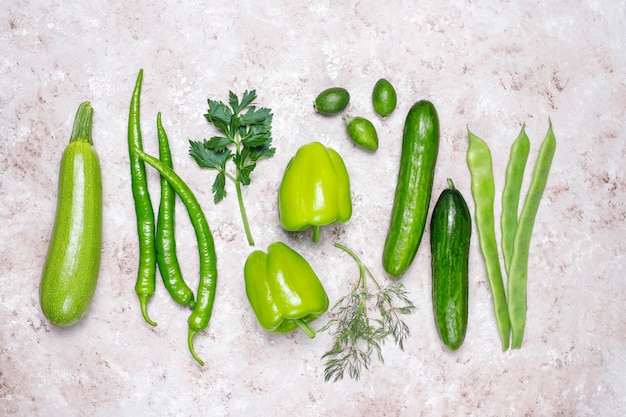 Fresh green vegetables on concrete surface