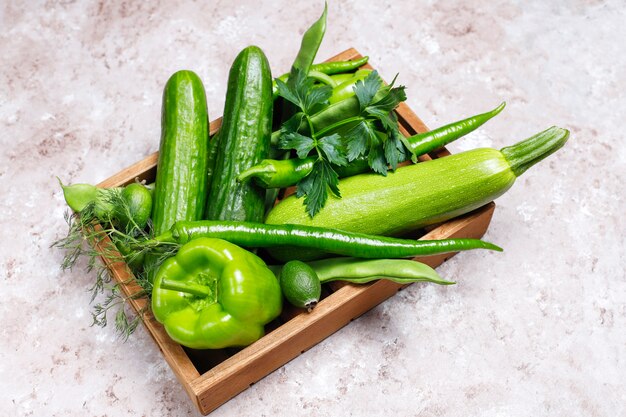 Fresh green vegetables on concrete surface