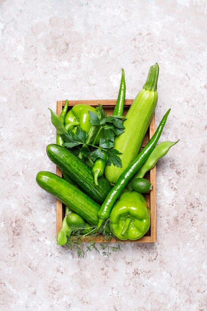 Fresh green vegetables on concrete surface